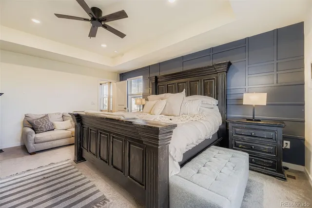 a bedroom with a bed and a couch