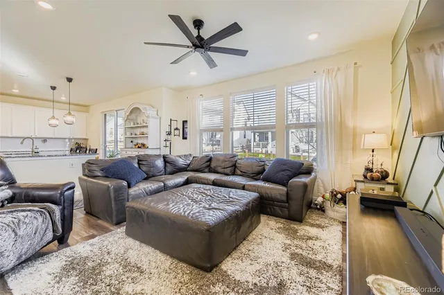 a living room with furniture and a large window