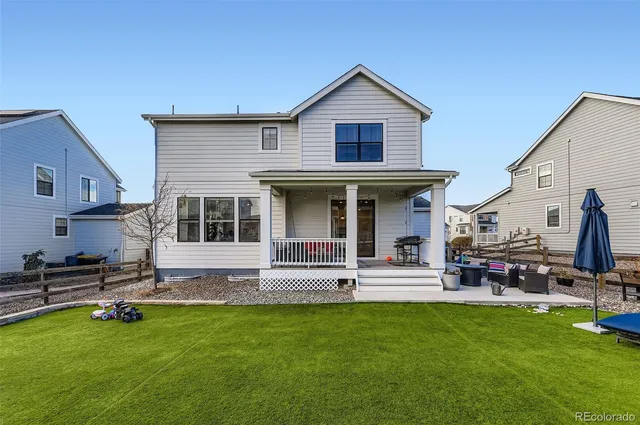 a front view of house with a garden and patio