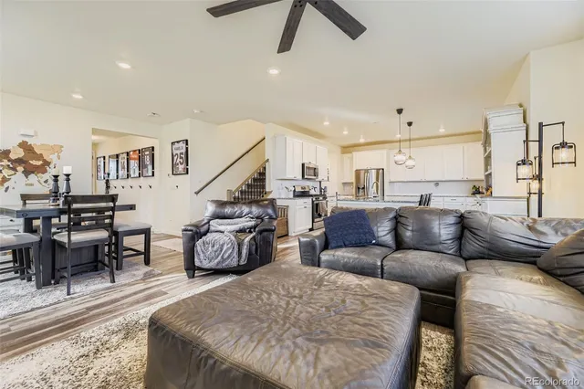 a living room with furniture and a rug