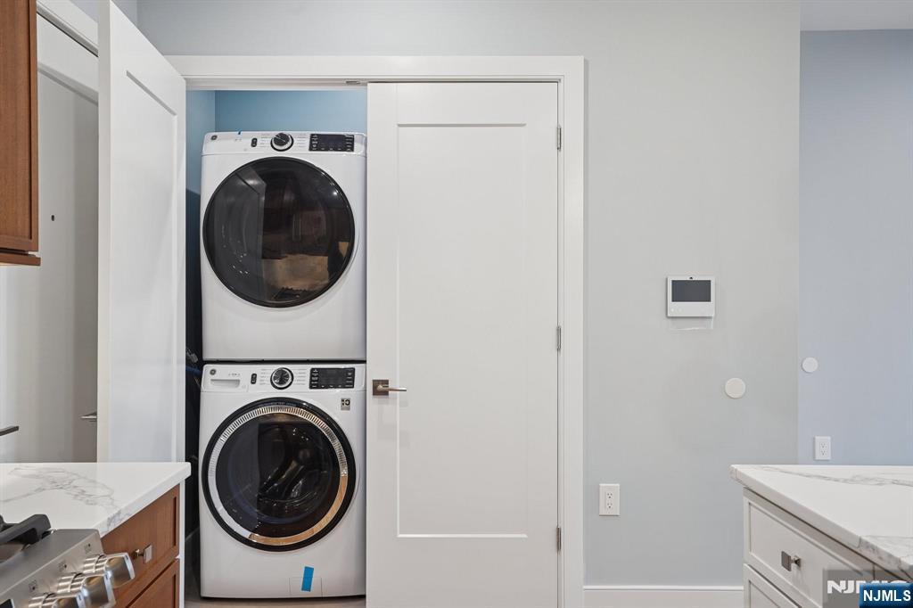 108 Montgomery Street Bloomfield, NJ 07003 - Photo 18 of 31 a view of a hallway with washer and dryer