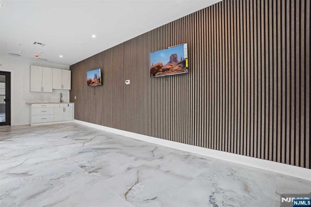108 Montgomery Street Bloomfield, NJ 07003 - Photo 20 of 31 a view of a livingroom with an empty space