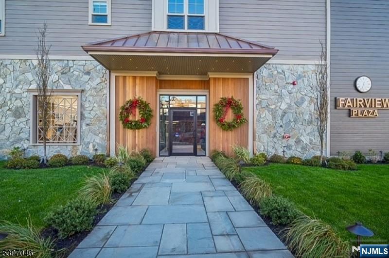 108 Montgomery Street Bloomfield, NJ 07003 - Photo 2 of 31 a view of a brick house with a yard