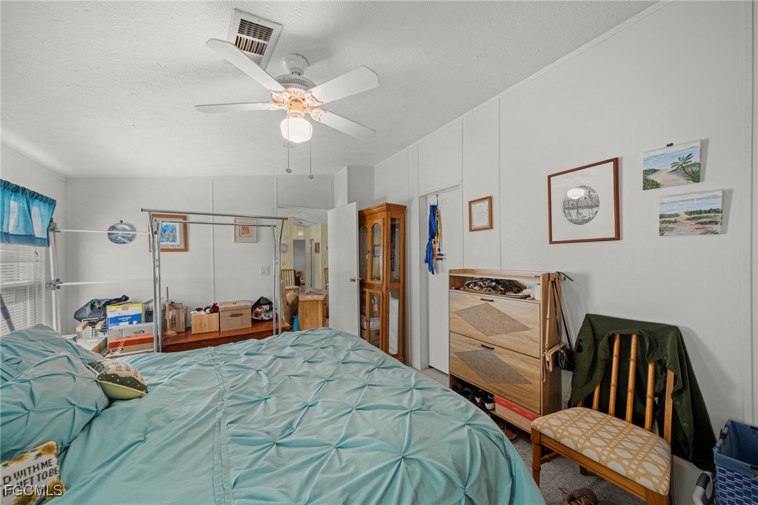 370 Nicklaus Boulevard North Fort Myers, FL 33903 - Photo 13 of 30 a bedroom with furniture and a bed