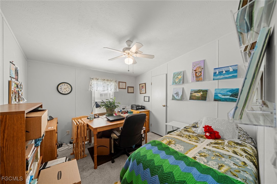 370 Nicklaus Boulevard North Fort Myers, FL 33903 - Photo 14 of 30 a living room with furniture and a flat screen tv
