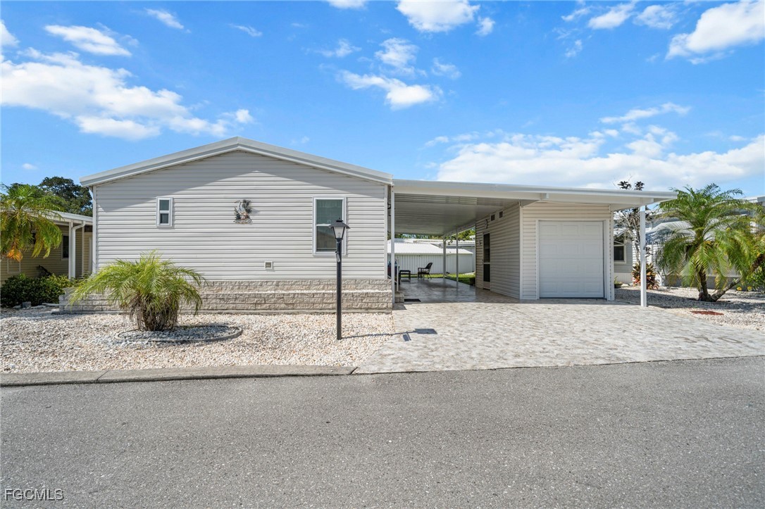 370 Nicklaus Boulevard North Fort Myers, FL 33903 - Photo 20 of 30 a house view with a outdoor space