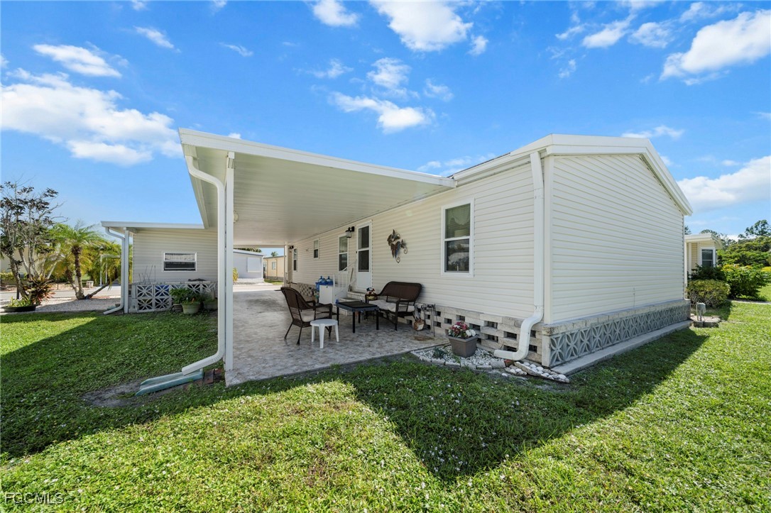 370 Nicklaus Boulevard North Fort Myers, FL 33903 - Photo 21 of 30 a view of outdoor space yard and patio