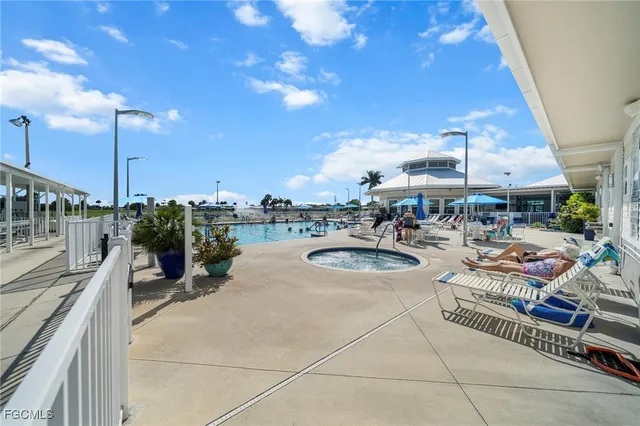 a view of a patio with a table and chairs under an umbrella