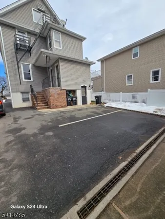a view of a house with a flat screen tv