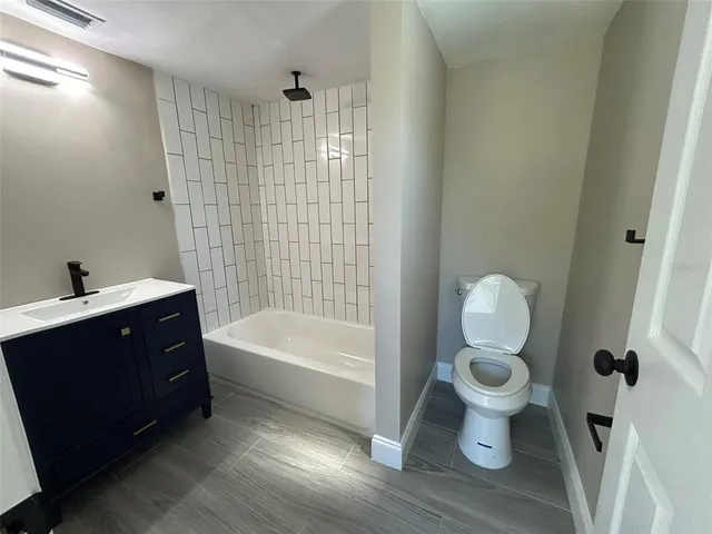 a bathroom with a sink toilet a shower and bathtub