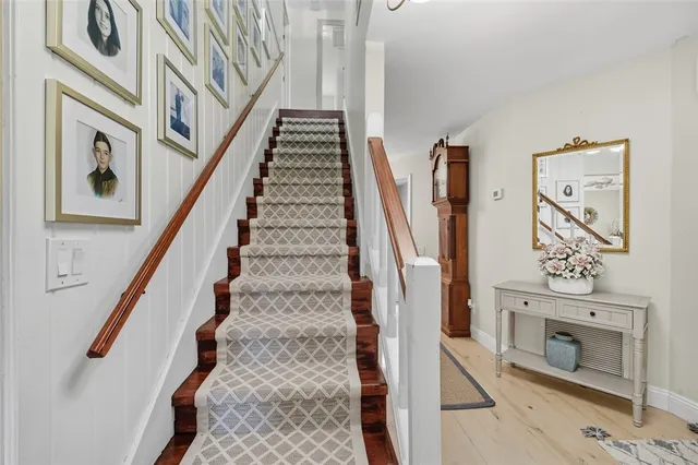 a view of an entryway with wooden floor