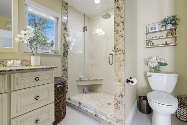 a bathroom with a sink a toilet and mirror