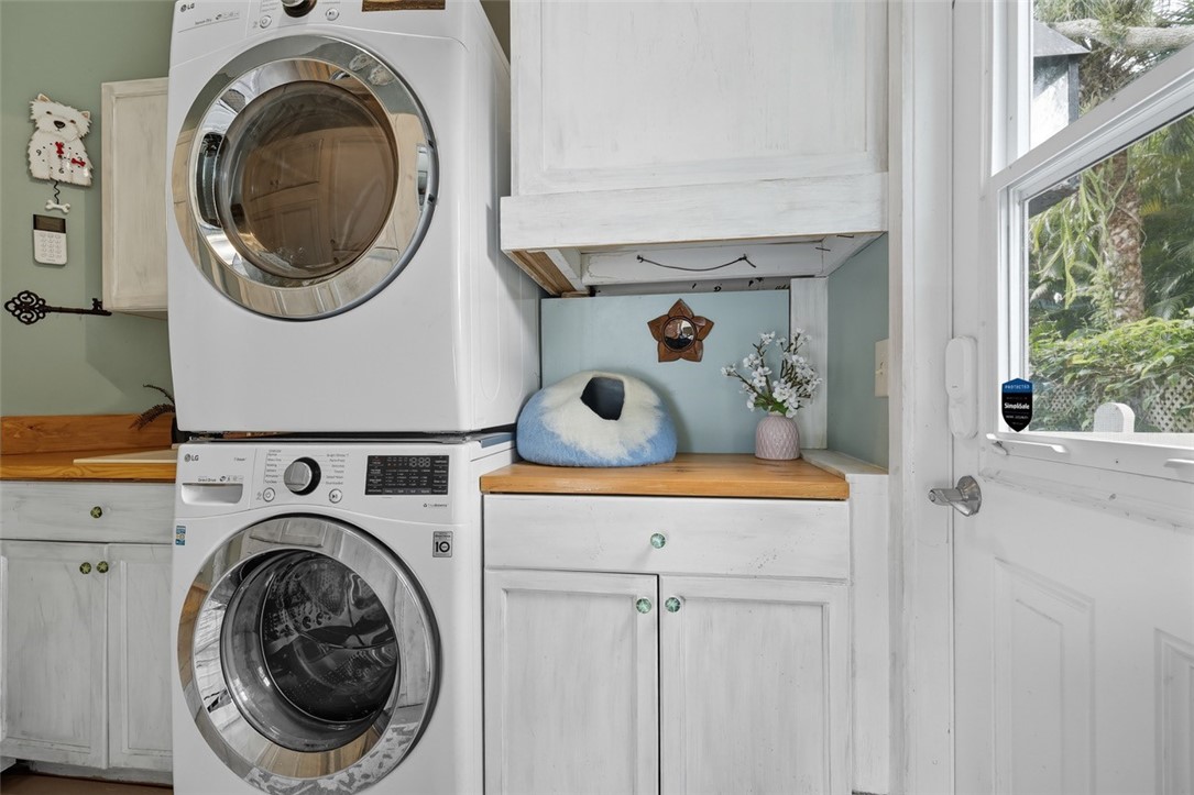 902 Tides Road Vero Beach, FL 32963 - Photo 24 of 25 a utility room with dryer and washer
