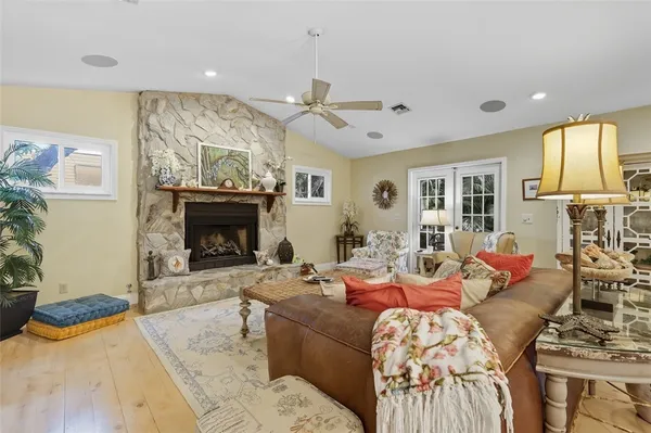 a living room with furniture and a fireplace