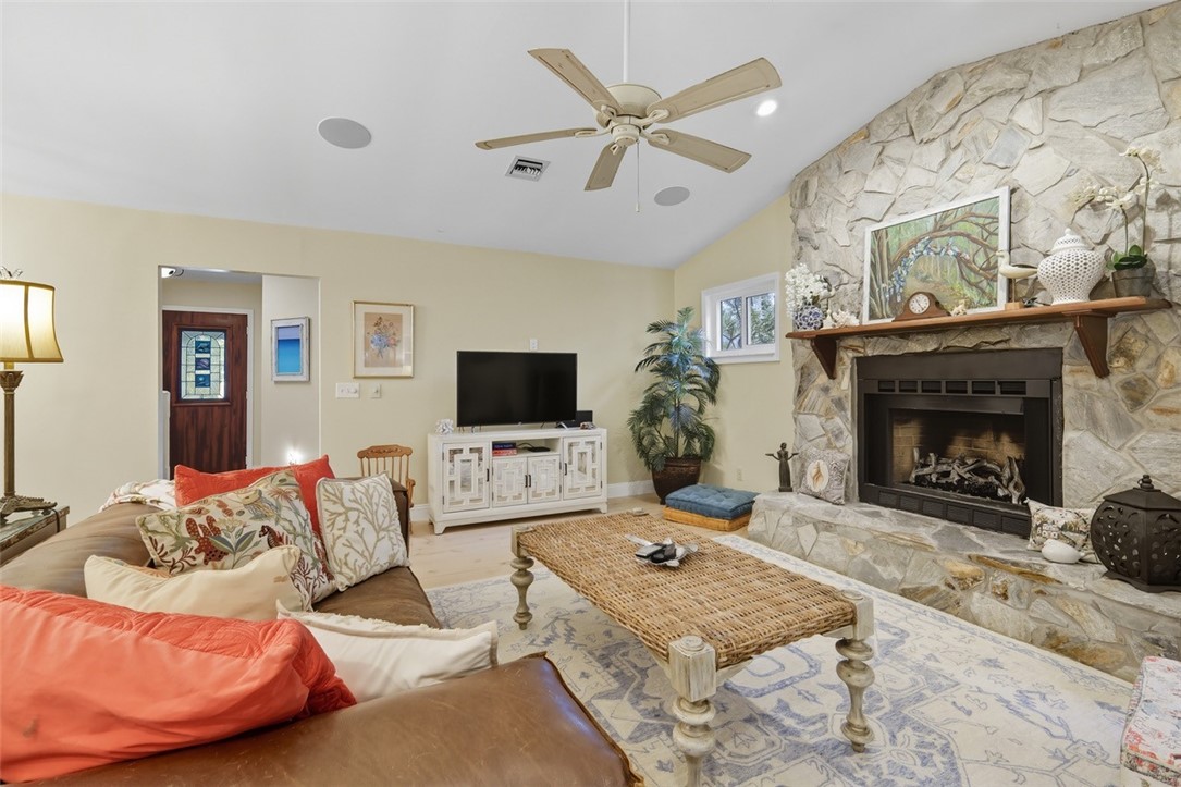 902 Tides Road Vero Beach, FL 32963 - Photo 9 of 25 a living room with furniture and a fireplace