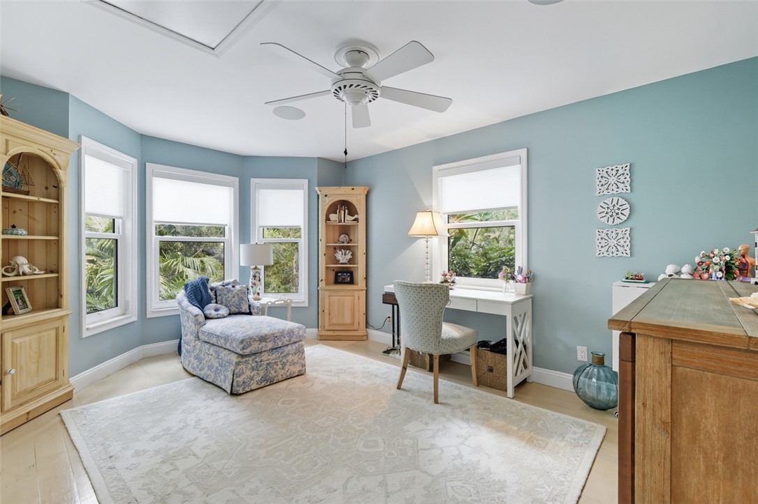 902 Tides Road Vero Beach, FL 32963 - Photo 10 of 25 a living room with furniture and a large window