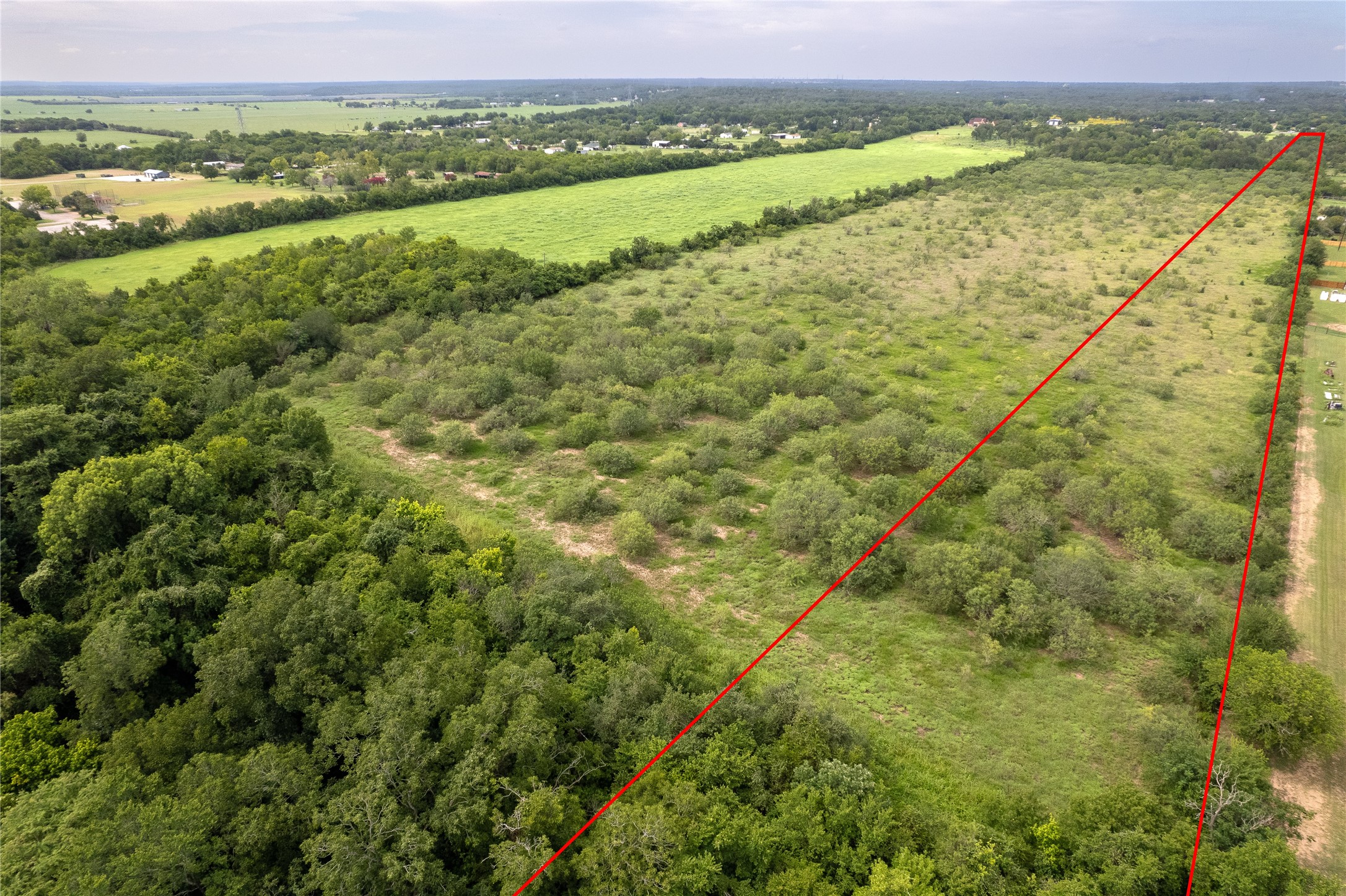 969 Rd Elgin Tx 78602 Road Elgin, TX 78621 - Photo 13 of 17 Overview of rural landscape featuring property parcel outlined