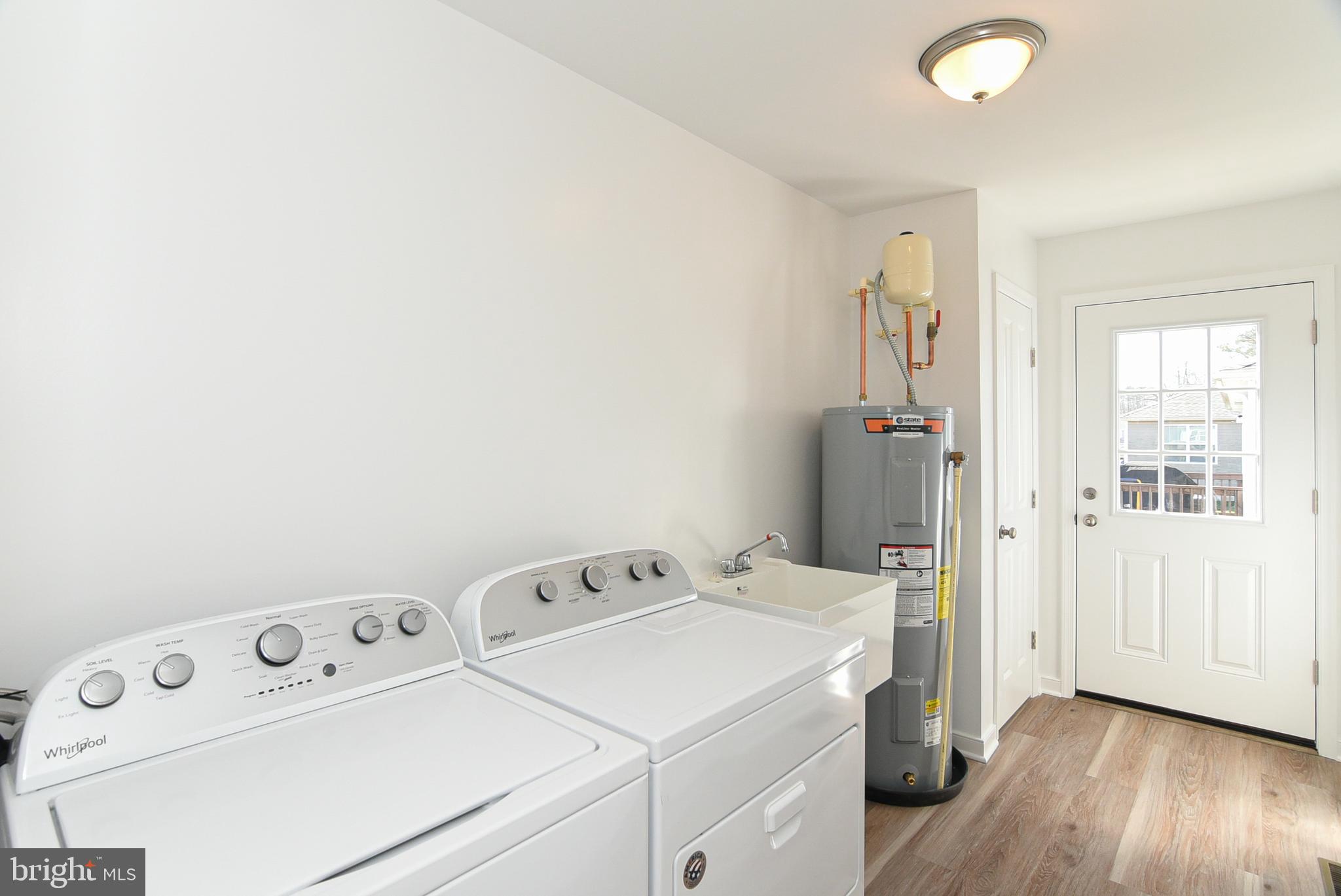 68 Randall Road Colonial Beach, VA 22443 - Photo 10 of 34 Laundry Room Washer/Dryer, Sink, Water Heater