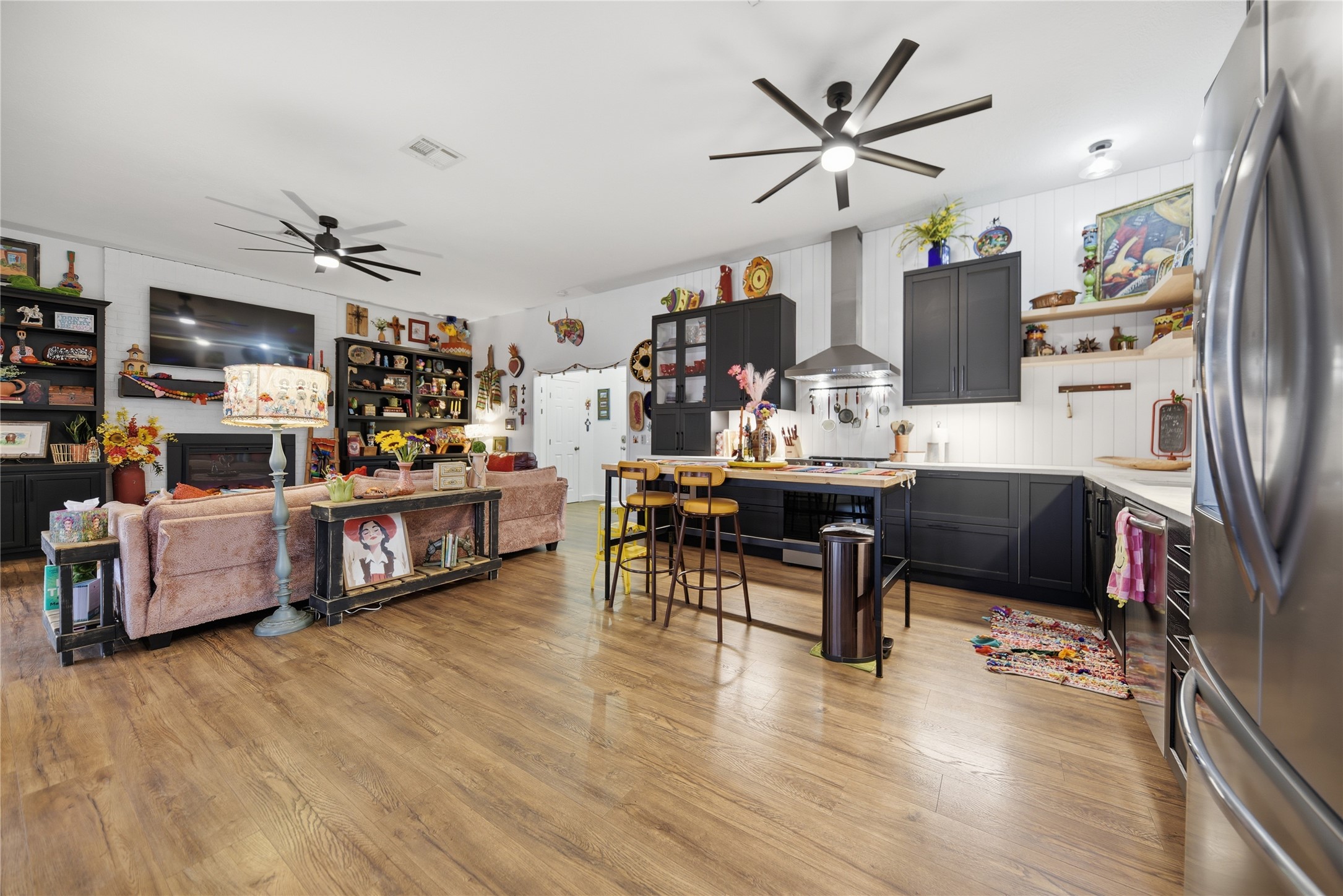 540 Hickory Creek Road Bellville, TX 77418 - Photo 12 of 49 a living room with fireplace furniture and a flat screen tv