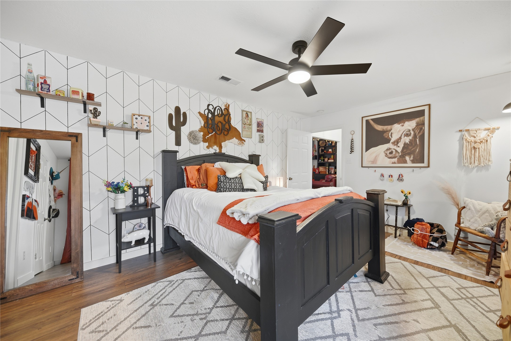 540 Hickory Creek Road Bellville, TX 77418 - Photo 16 of 49 a bedroom with bed and wooden floor