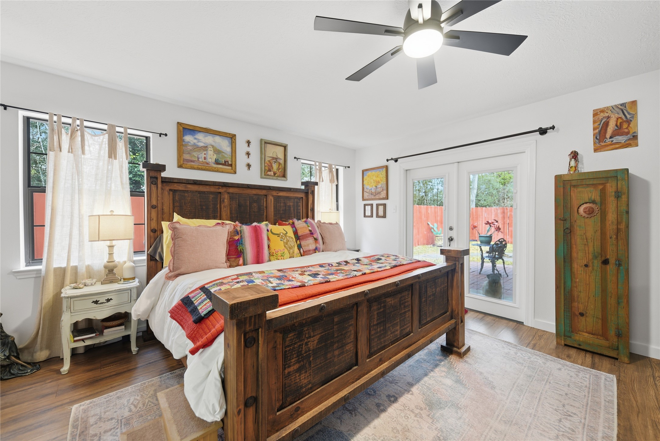 540 Hickory Creek Road Bellville, TX 77418 - Photo 20 of 49 a bedroom with a bed and a chandelier