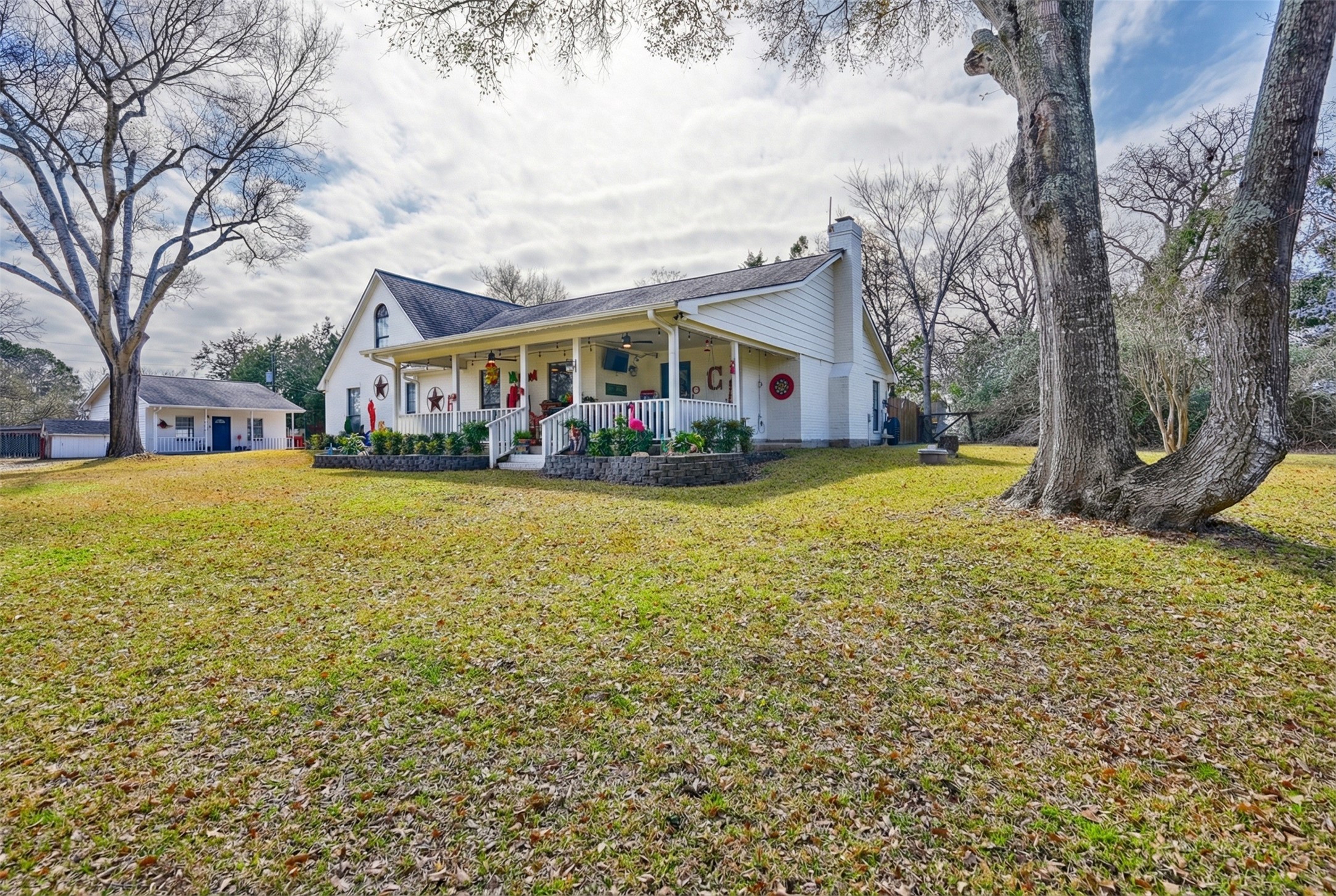 540 Hickory Creek Road Bellville, TX 77418 - Photo 2 of 49 a view of a house with a big yard and large trees