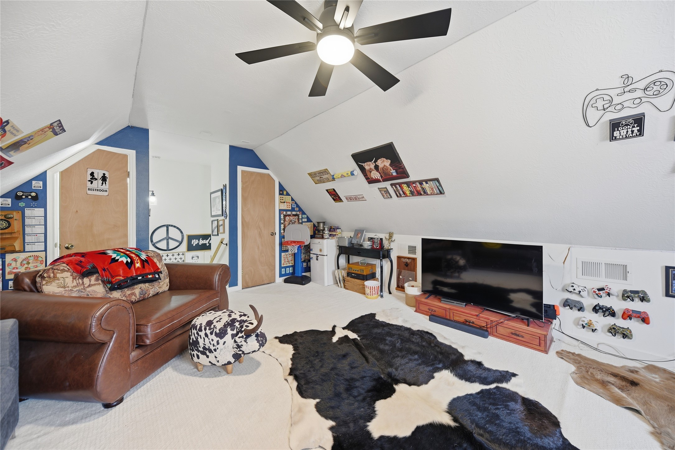 540 Hickory Creek Road Bellville, TX 77418 - Photo 26 of 49 a living room with furniture and a flat screen tv