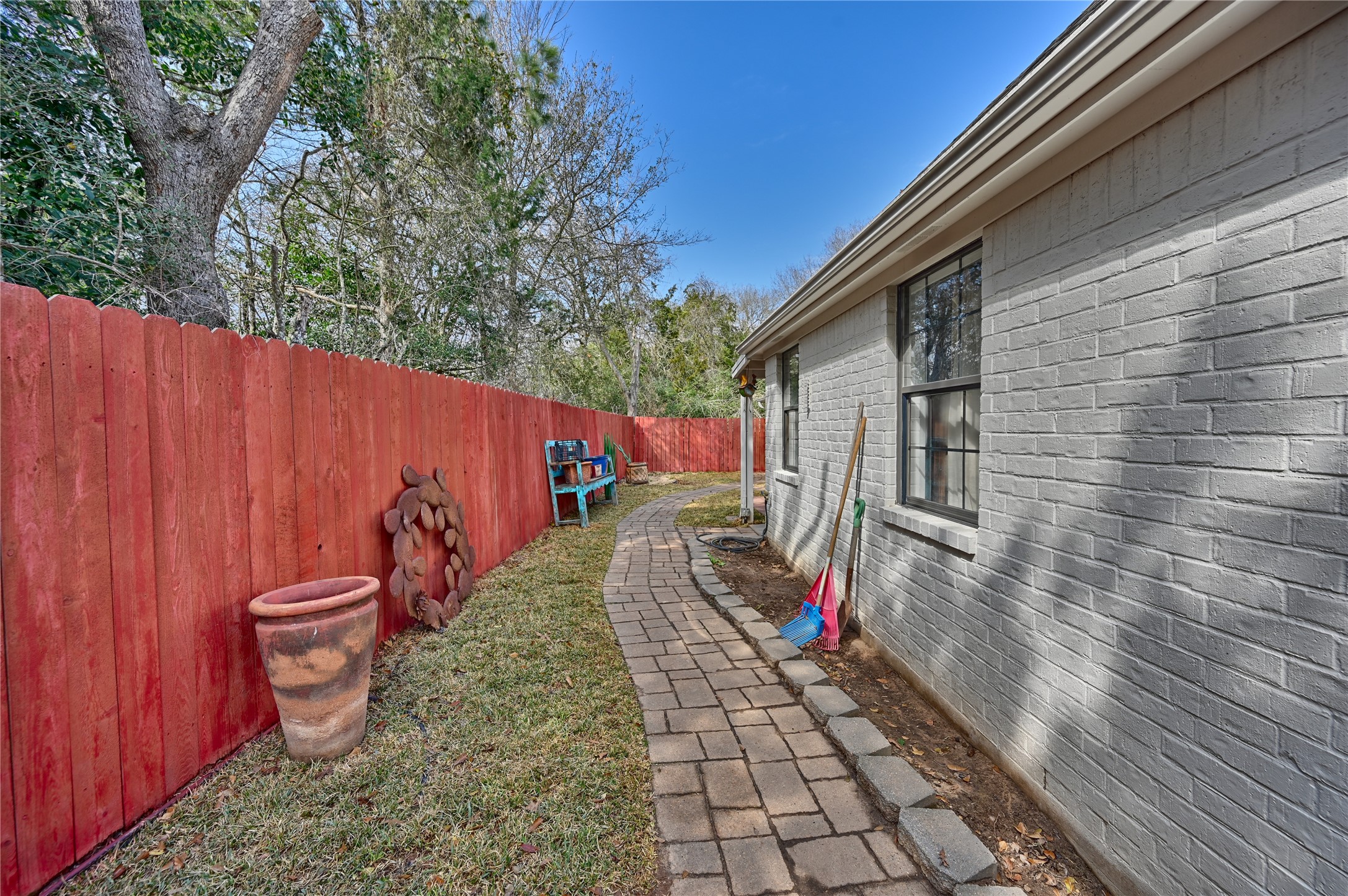 540 Hickory Creek Road Bellville, TX 77418 - Photo 33 of 49 a view of a backyard with wooden fence and a large tree