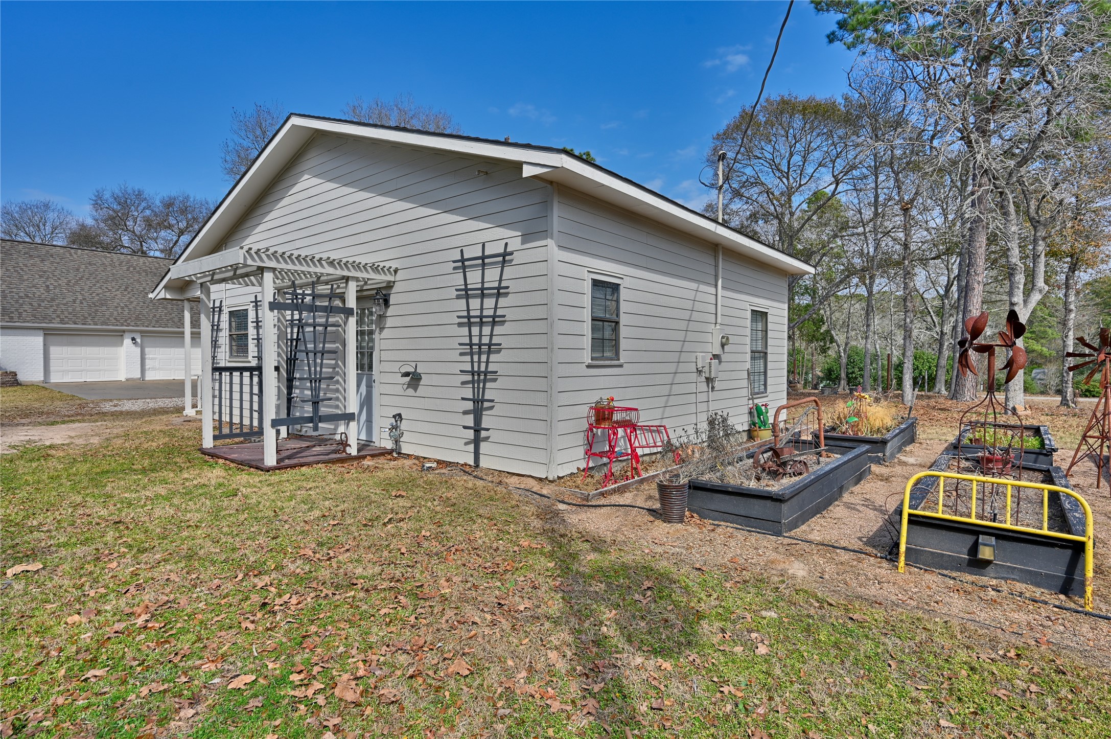 540 Hickory Creek Road Bellville, TX 77418 - Photo 36 of 49 a view of a house with a yard patio and a garden