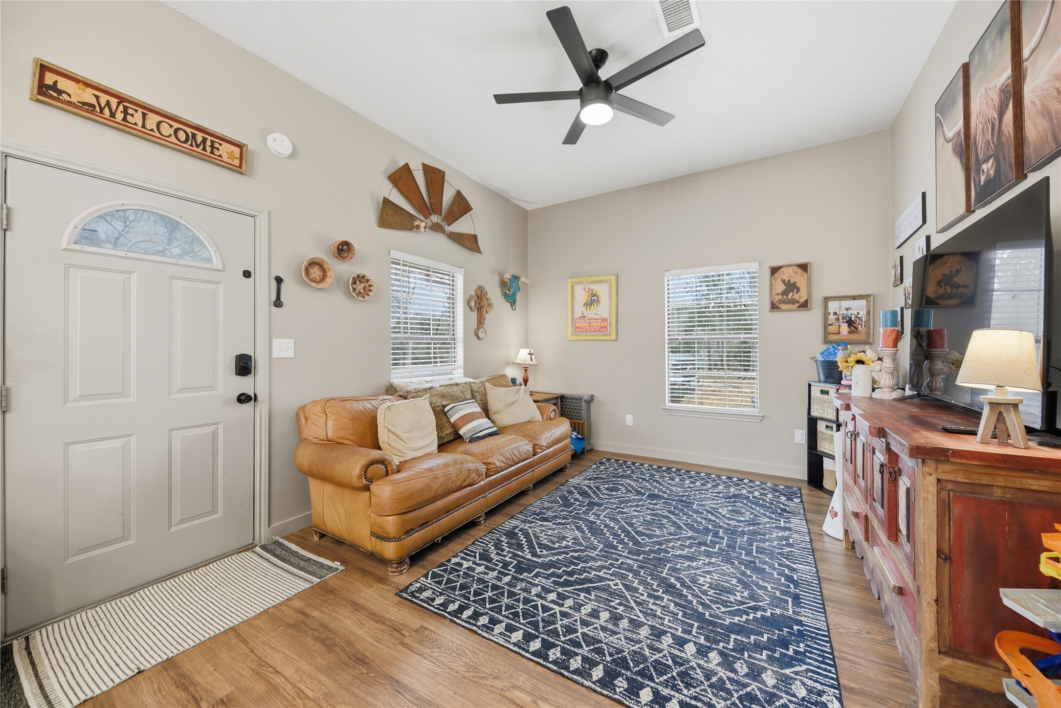 540 Hickory Creek Road Bellville, TX 77418 - Photo 37 of 49 a living room with furniture and a flat screen tv