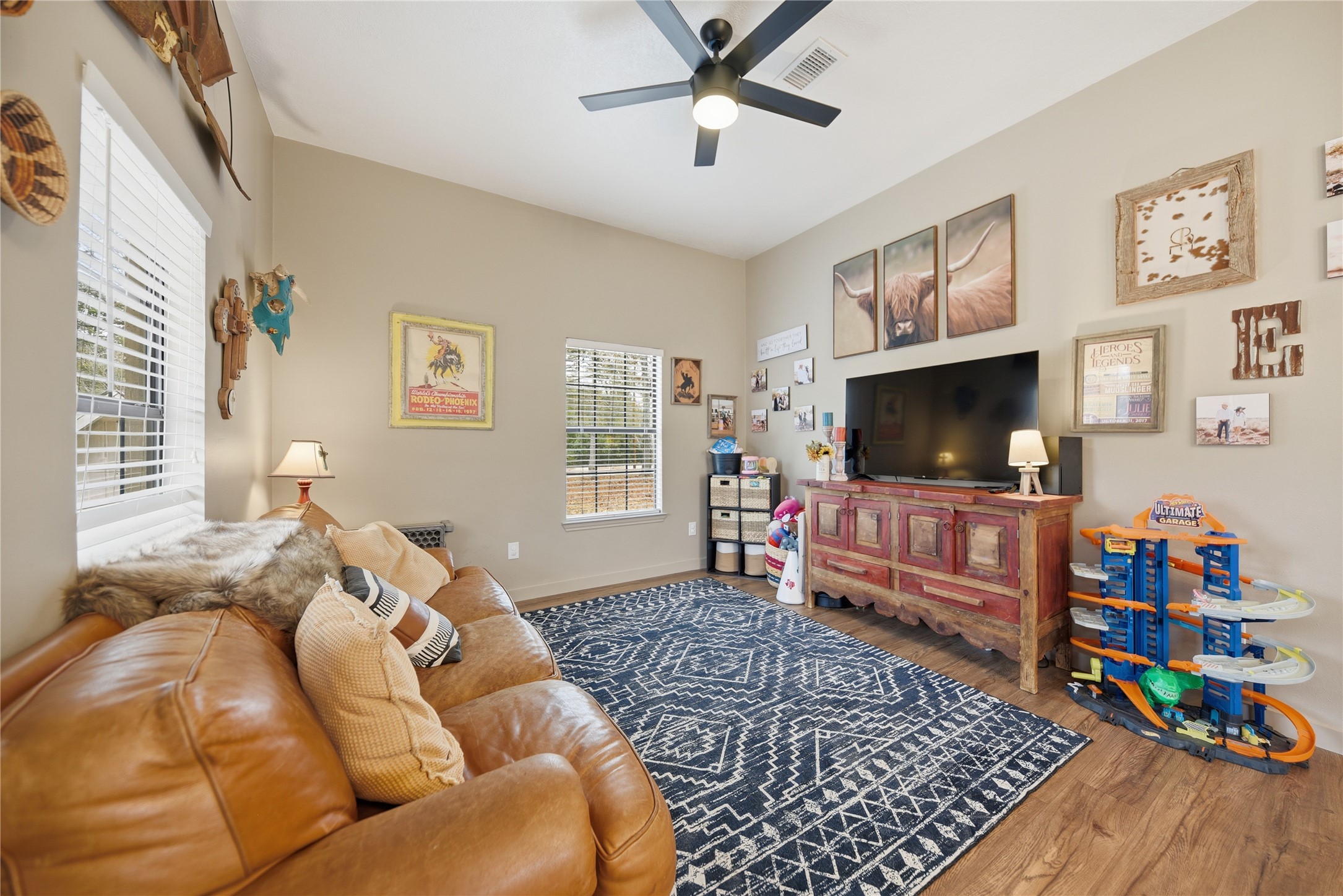 540 Hickory Creek Road Bellville, TX 77418 - Photo 38 of 49 a living room with furniture and a flat screen tv