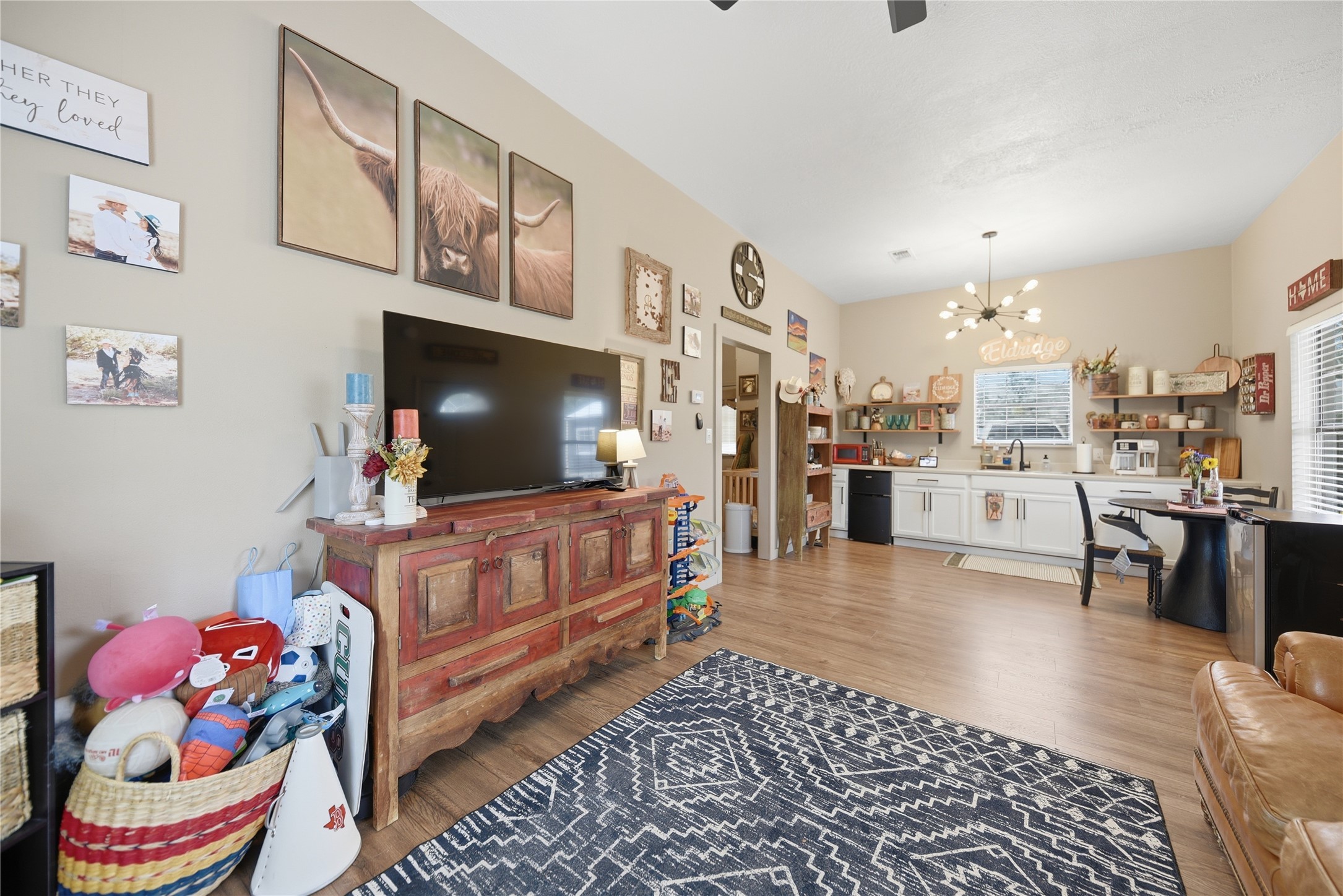 540 Hickory Creek Road Bellville, TX 77418 - Photo 40 of 49 a living room with furniture and a flat screen tv