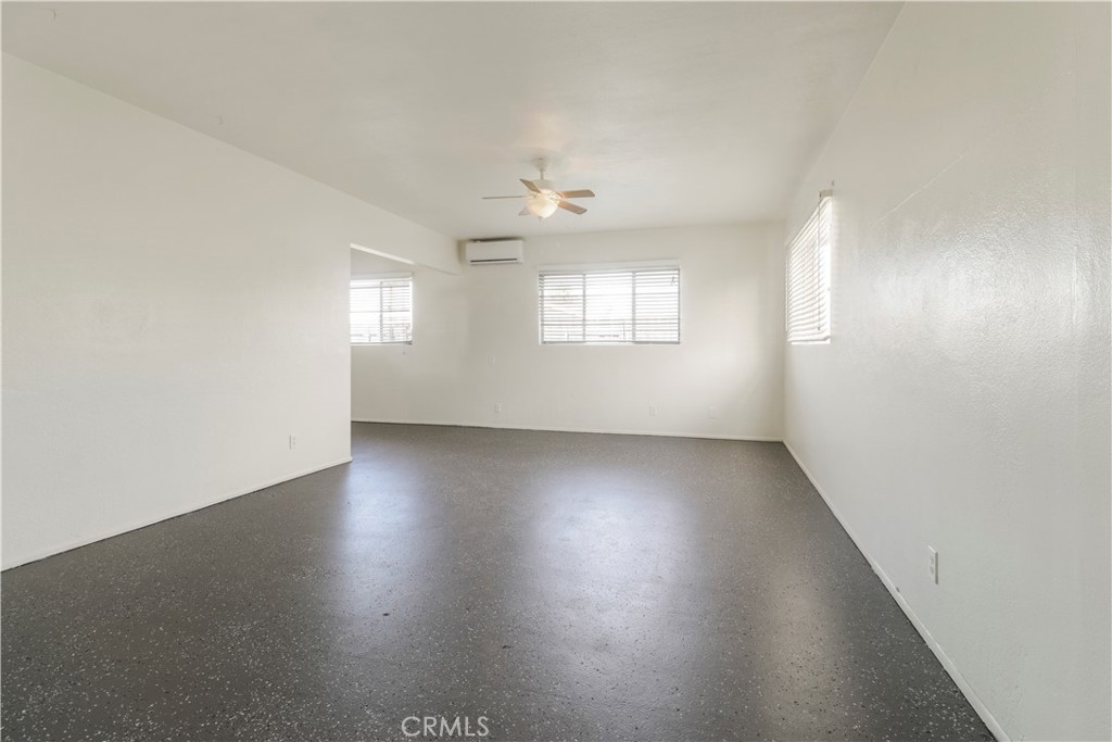 437 North Franklin Street Hemet, CA 92543 - Photo 15 of 25 an empty room with wooden floor and windows