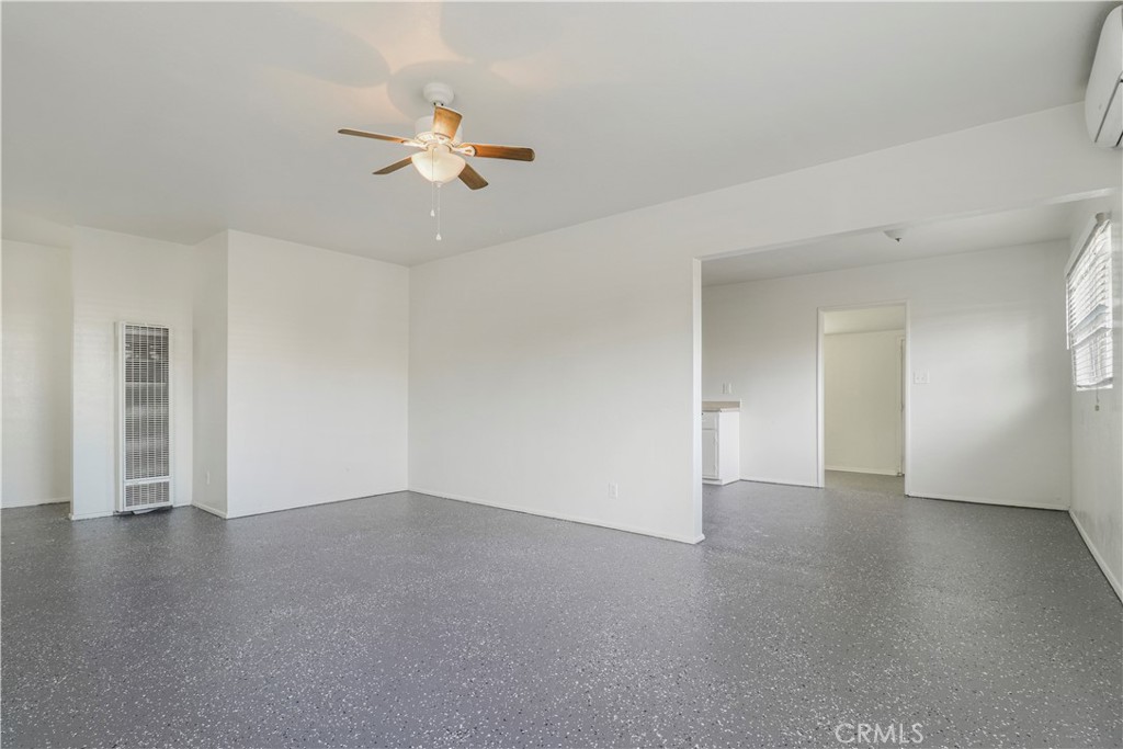 437 North Franklin Street Hemet, CA 92543 - Photo 18 of 25 a view of an empty room with wooden floor and a ceiling fan