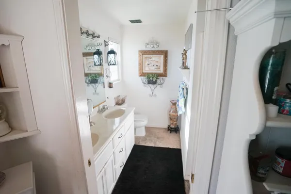 a bathroom with a sink and a shower curtain