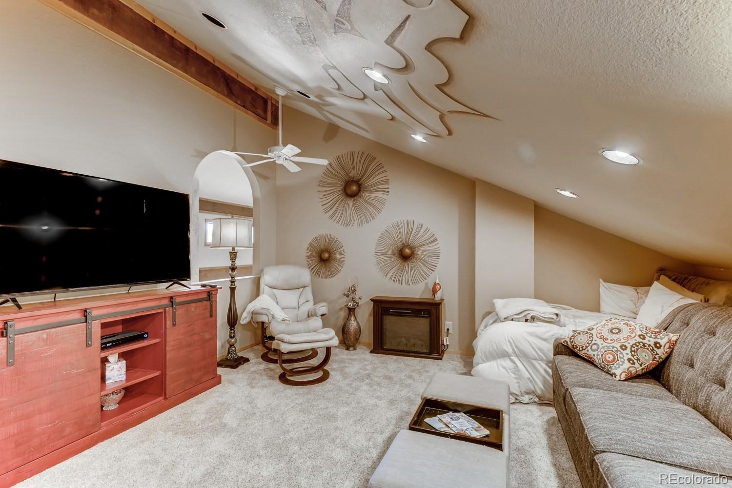869 Hill And Dale Road, Unit D Golden, CO 80401 - Photo 20 of 27 a living room with furniture and a flat screen tv