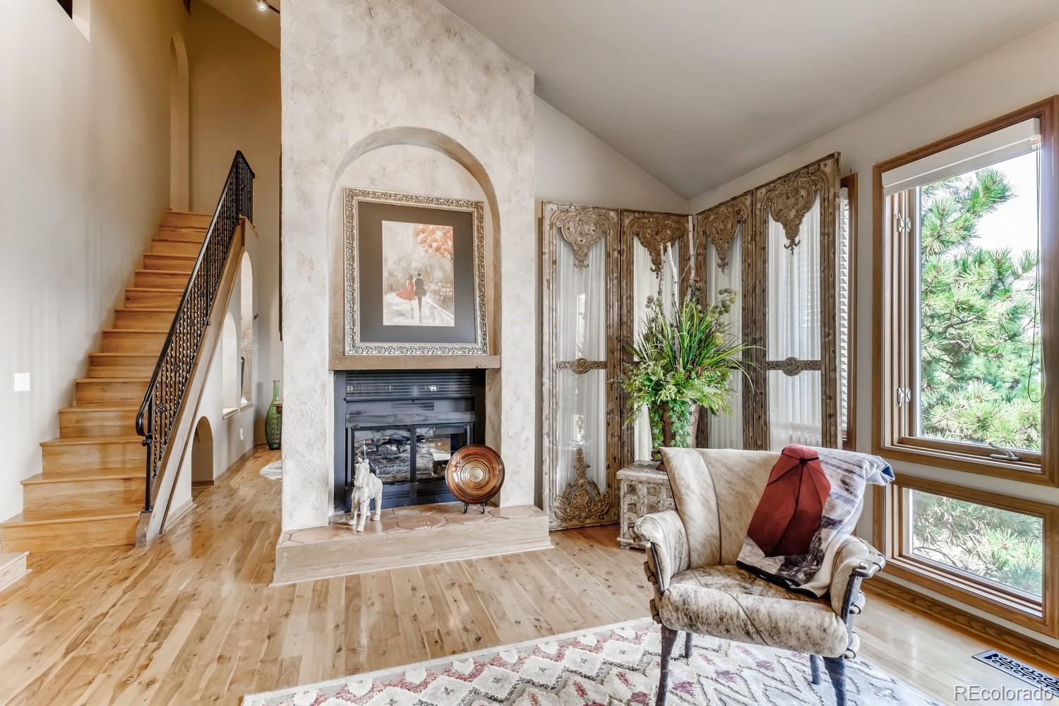869 Hill And Dale Road, Unit D Golden, CO 80401 - Photo 2 of 27 a living room with furniture and a fireplace