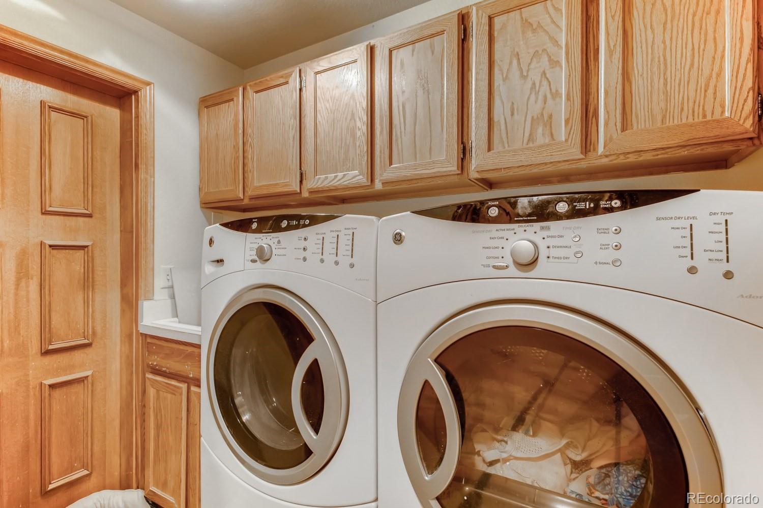 869 Hill And Dale Road, Unit D Golden, CO 80401 - Photo 21 of 27 a utility room with dryer and washer