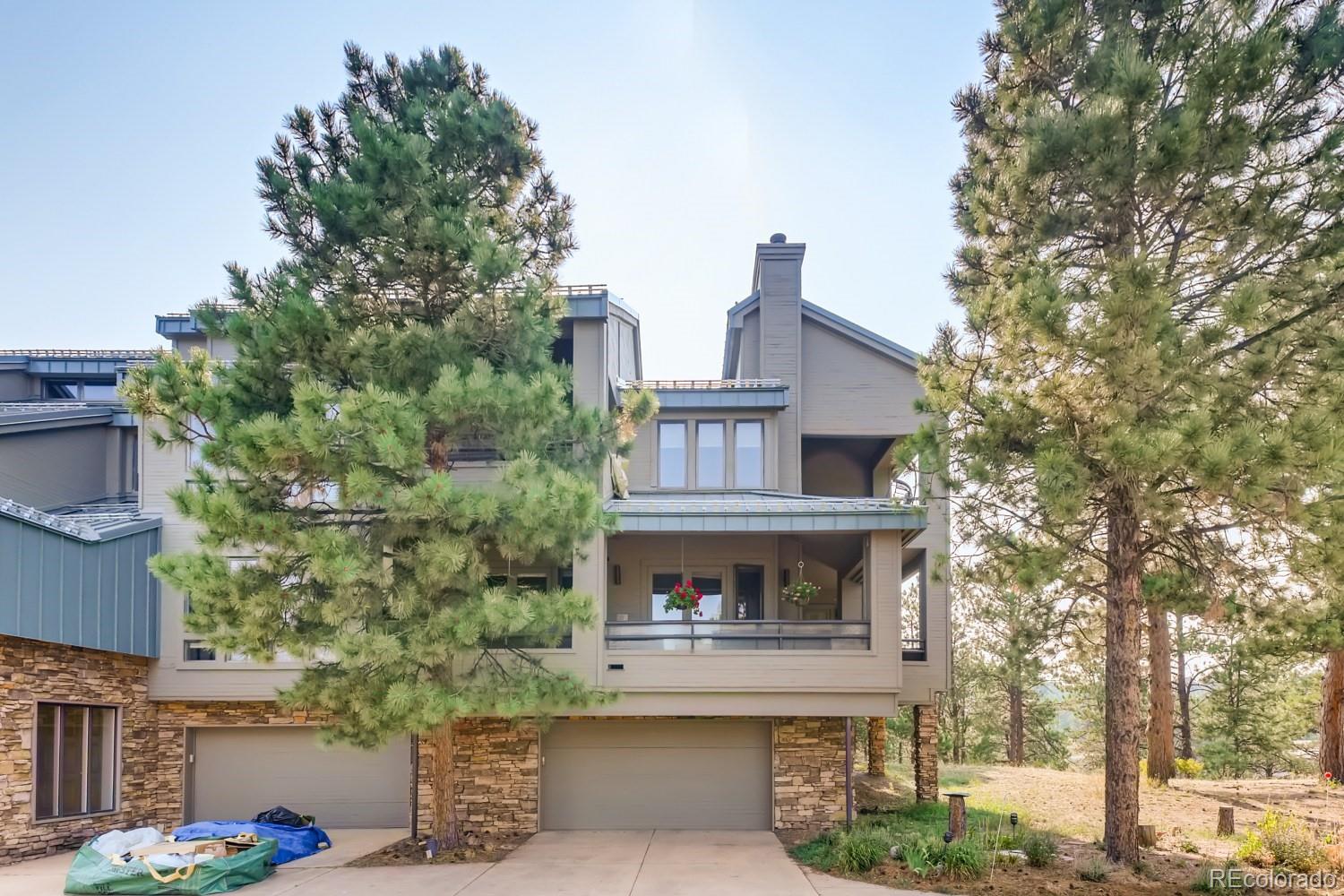 869 Hill And Dale Road, Unit D Golden, CO 80401 - Photo 25 of 27 a front view of a house with a garden