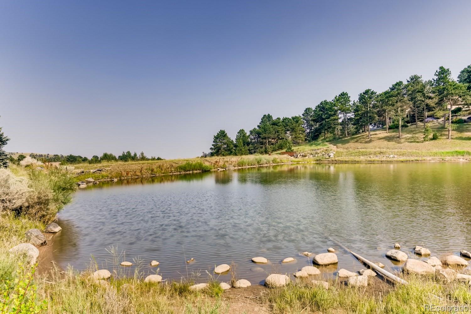 869 Hill And Dale Road, Unit D Golden, CO 80401 - Photo 27 of 27 a view of a lake with houses