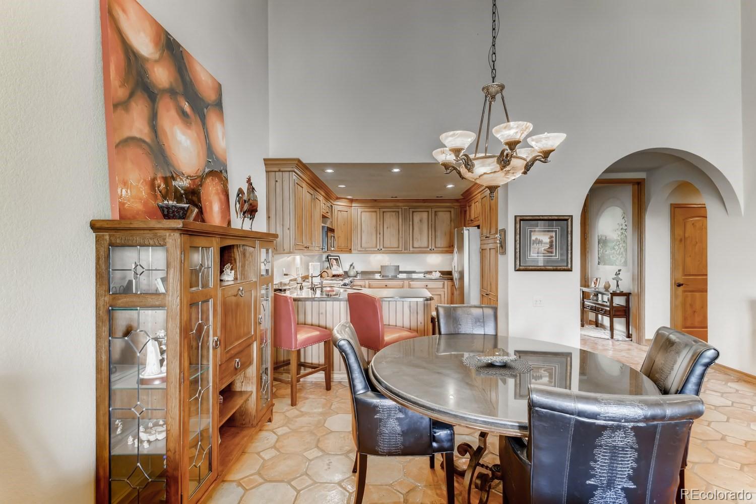869 Hill And Dale Road, Unit D Golden, CO 80401 - Photo 7 of 27 a view of a dining room with furniture and chandelier
