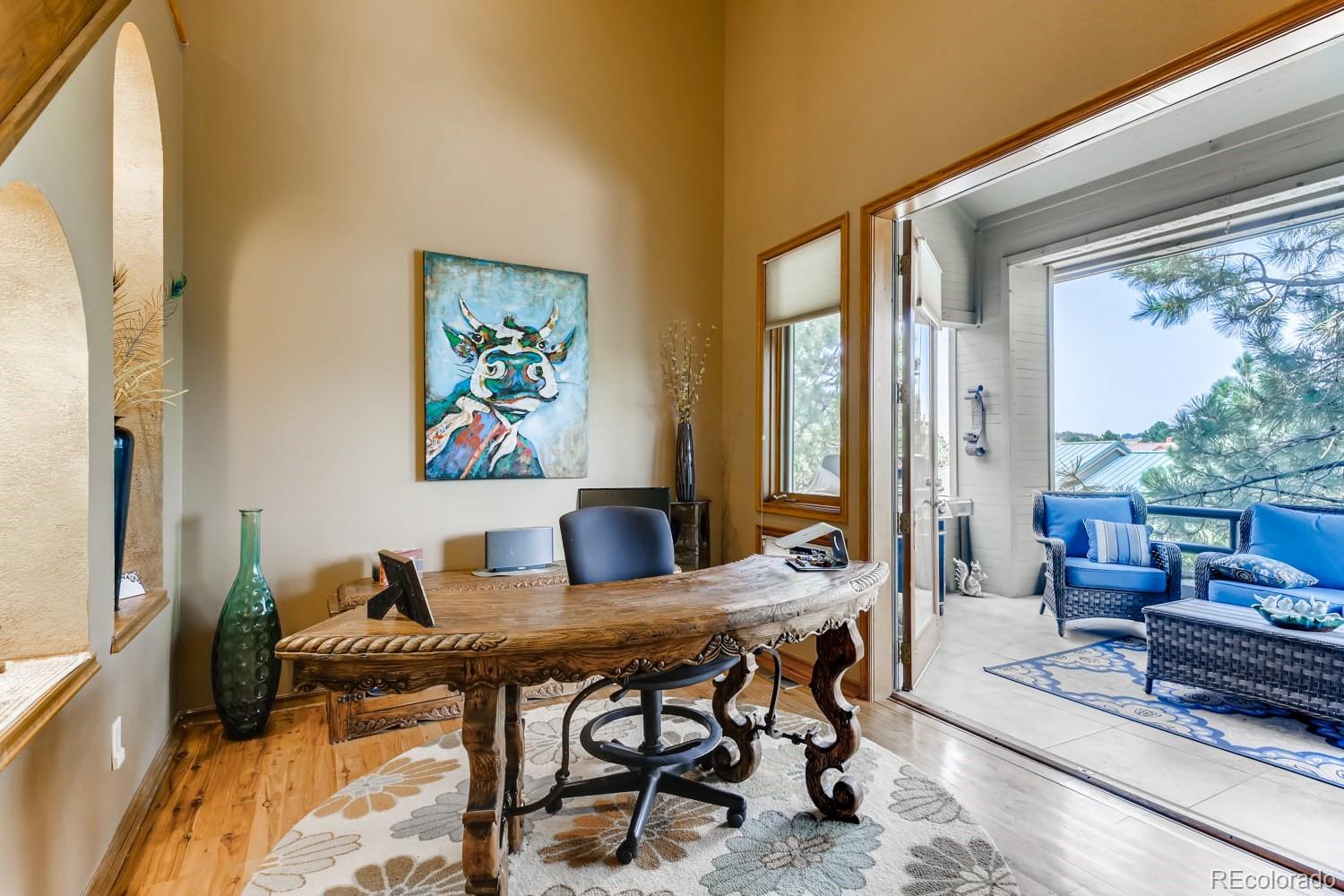 869 Hill And Dale Road, Unit D Golden, CO 80401 - Photo 9 of 27 a view of a dining room with furniture large window and outside view
