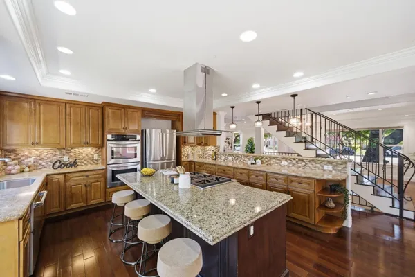 a bedroom with a bed large window and a couch