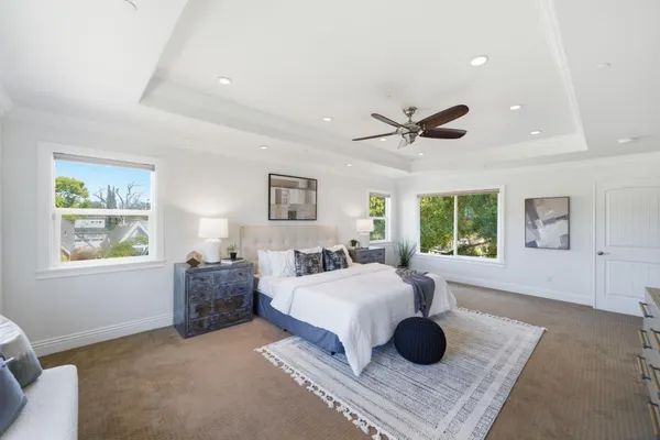 a living room with furniture pool table and window