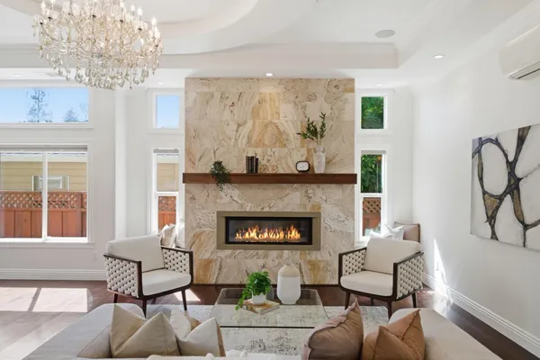 a kitchen with stainless steel appliances a stove a sink and a refrigerator