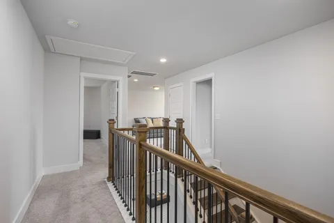 a spacious bedroom with a bed and a couch