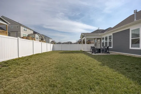 a view of a house with a backyard and a sink