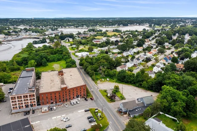 an aerial view of a house with a yard