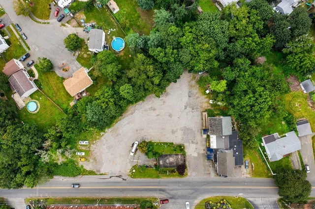 an aerial view of a house with yard