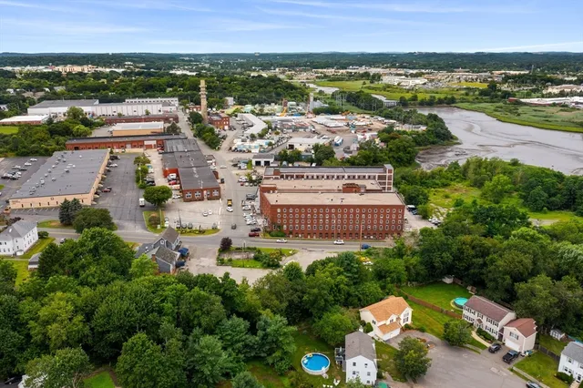 an aerial view of a city and lake view